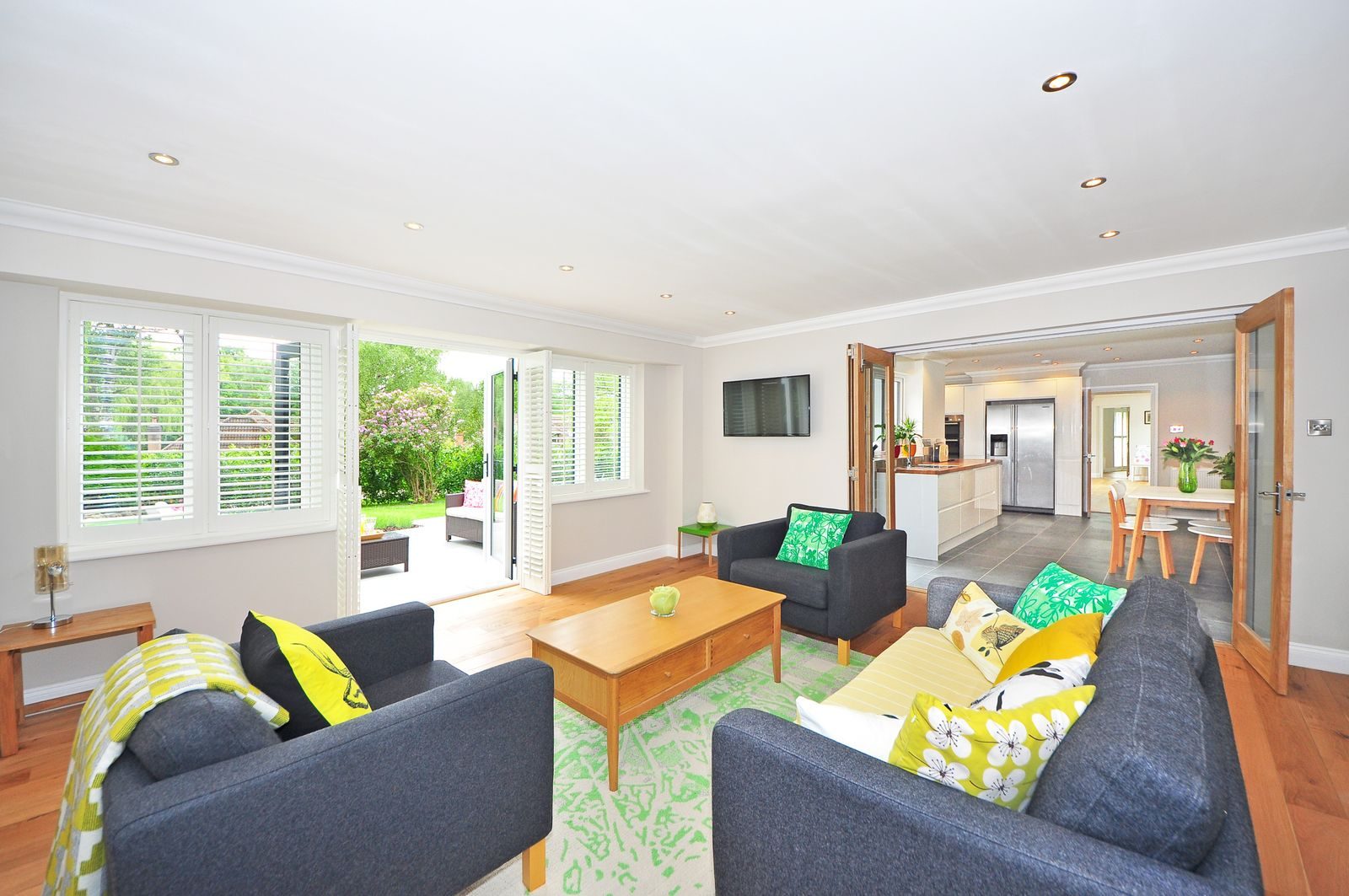 Bright open-plan living space with garden doors after a garage conversion