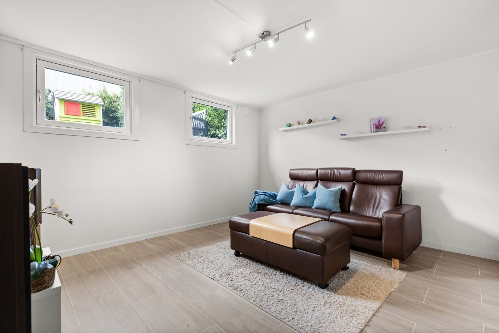 Bright finished living room created from a converted garage